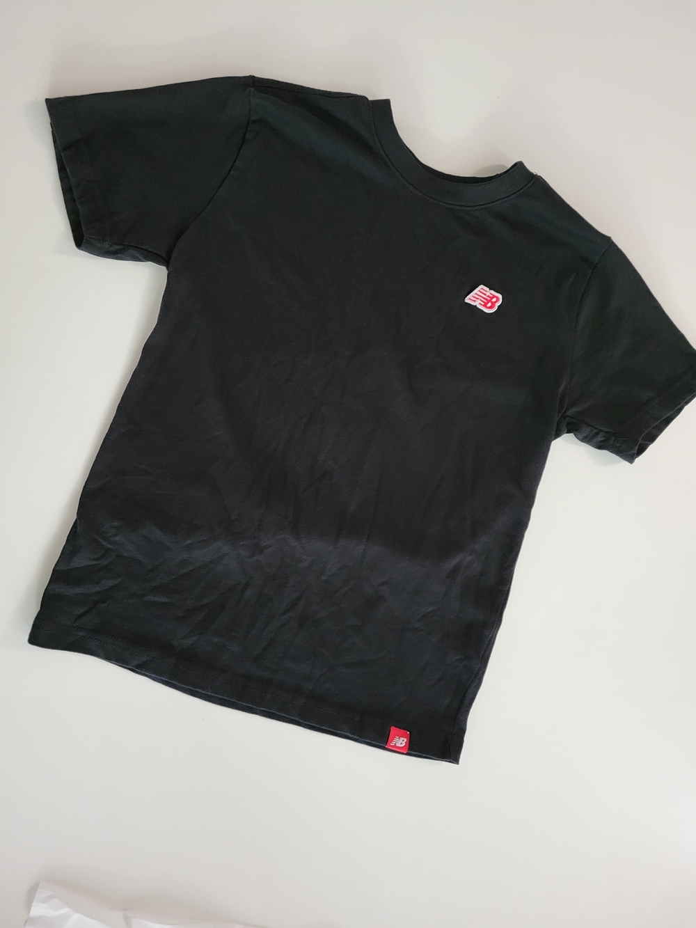 New Balance Boy's Black Short Sleeve Tee with Red Logo
